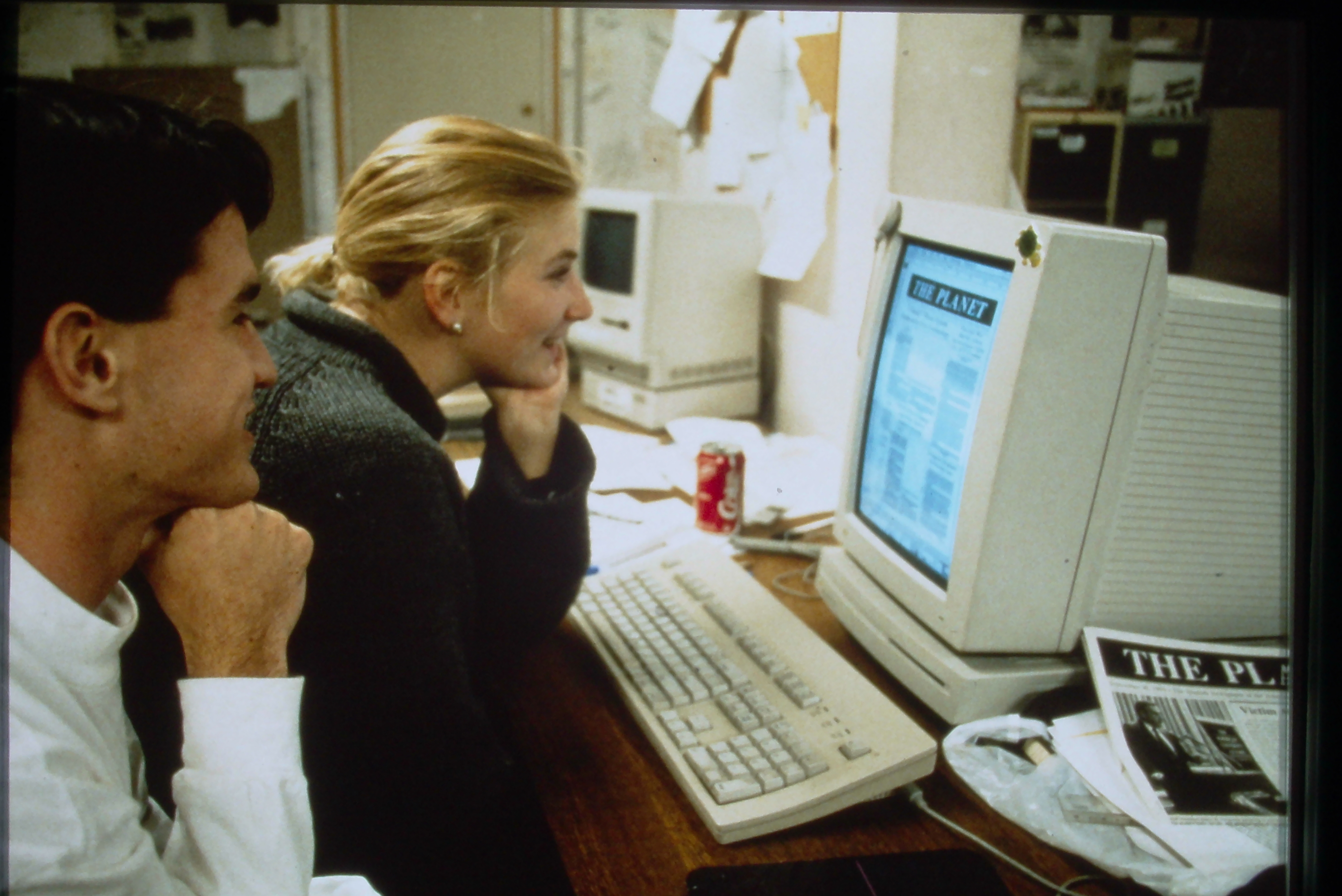 Students reading The Planet AUP Publication