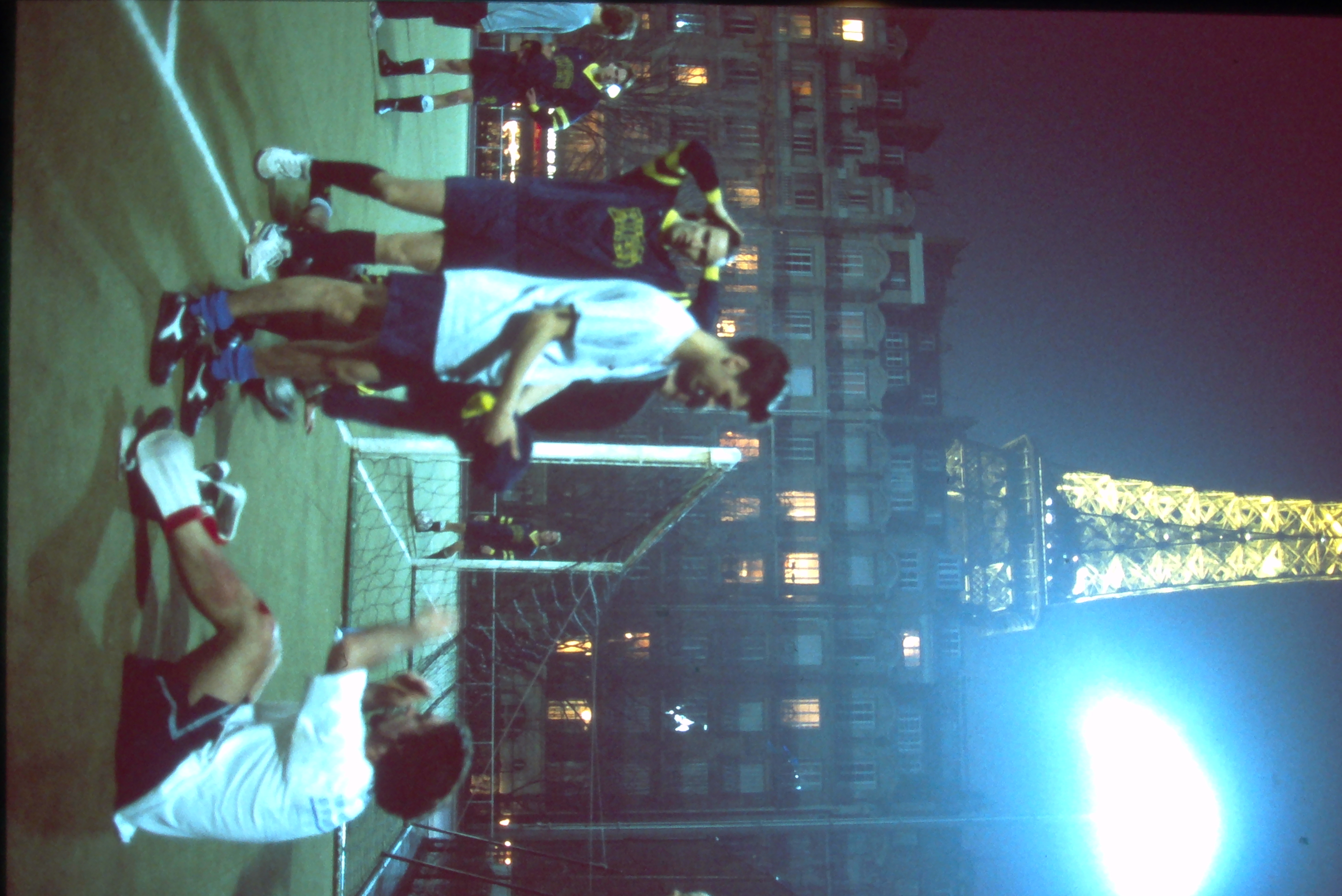 AUP students playing soccer at night