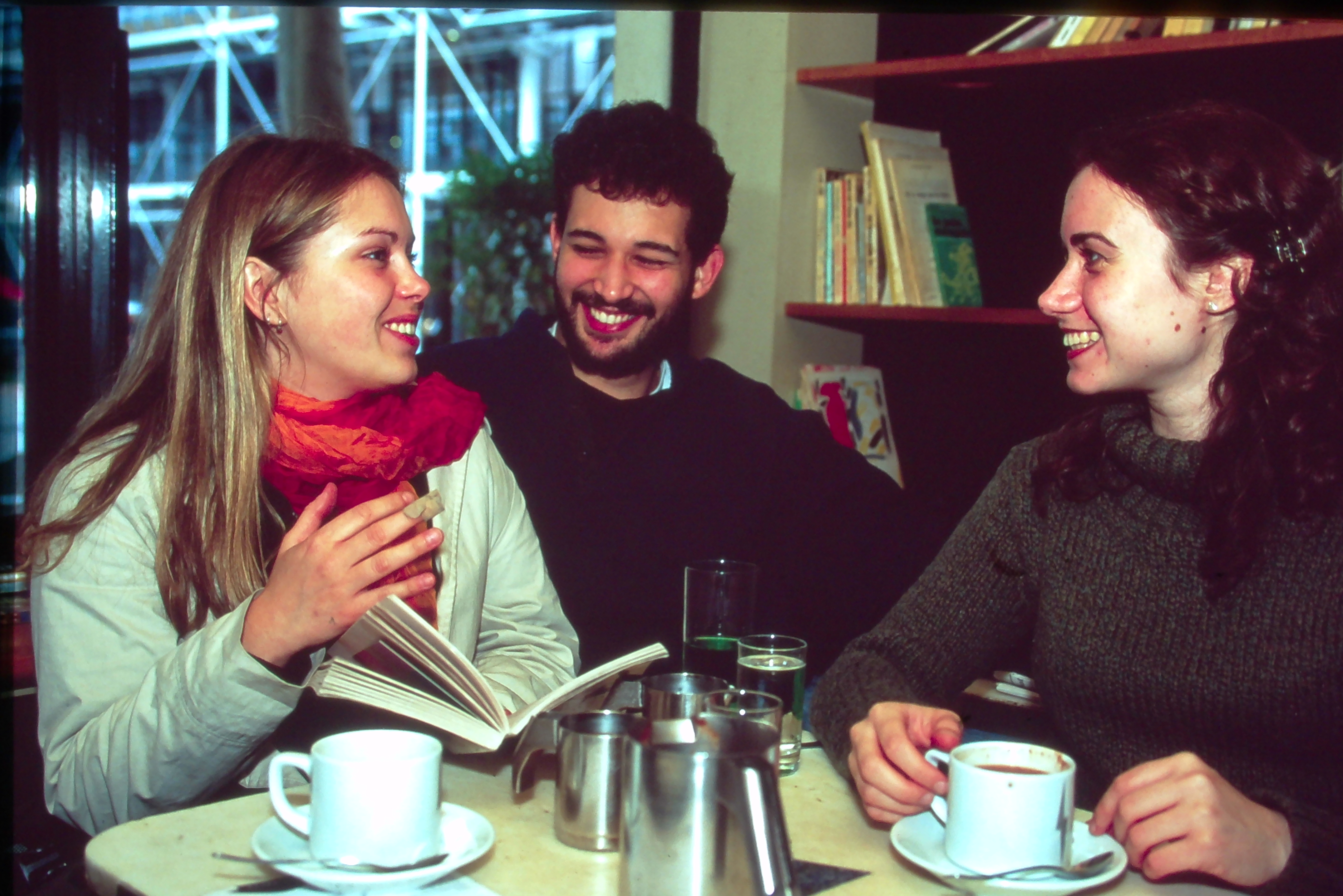 Students discussing books over coffee