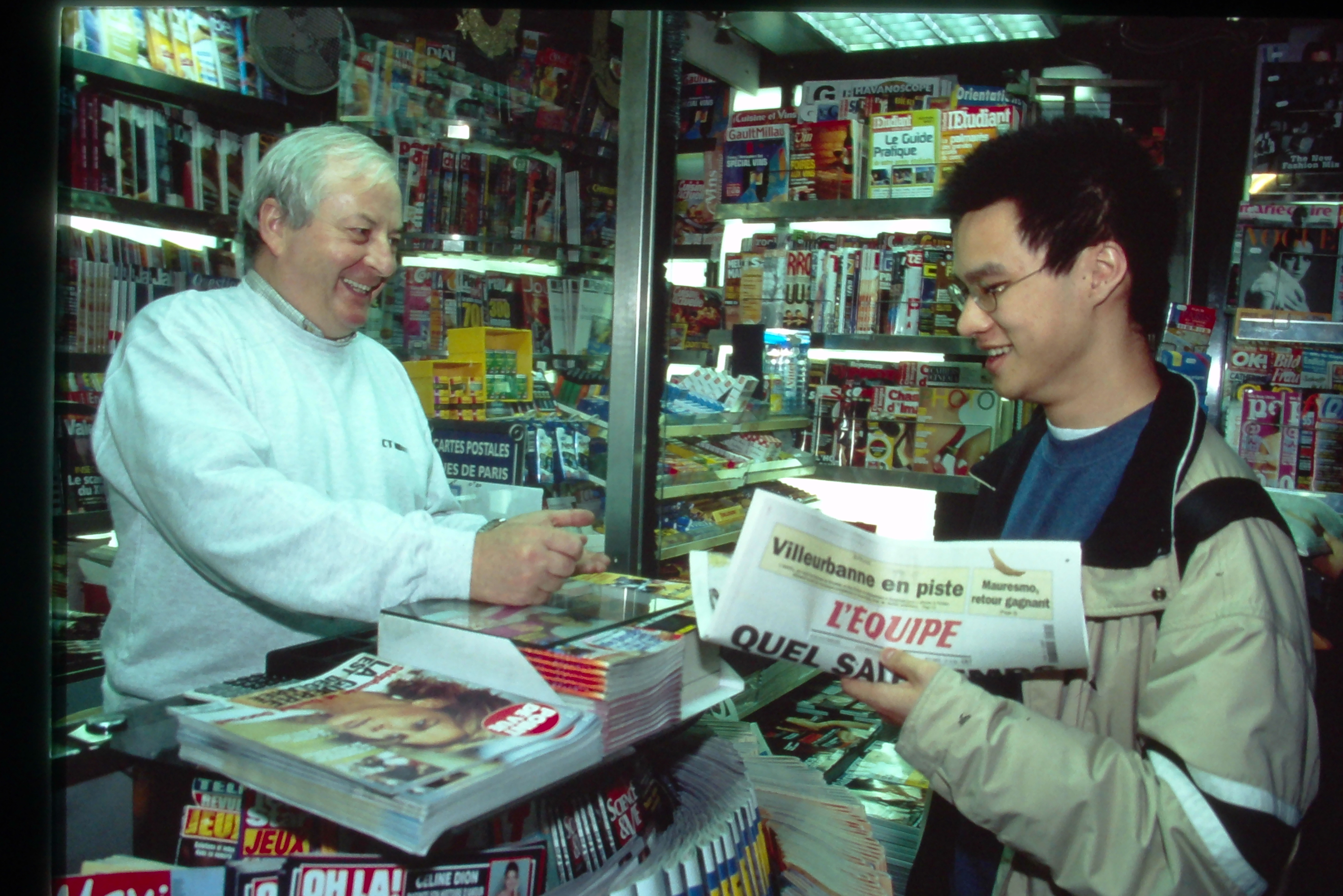 Student purchasing newspaper