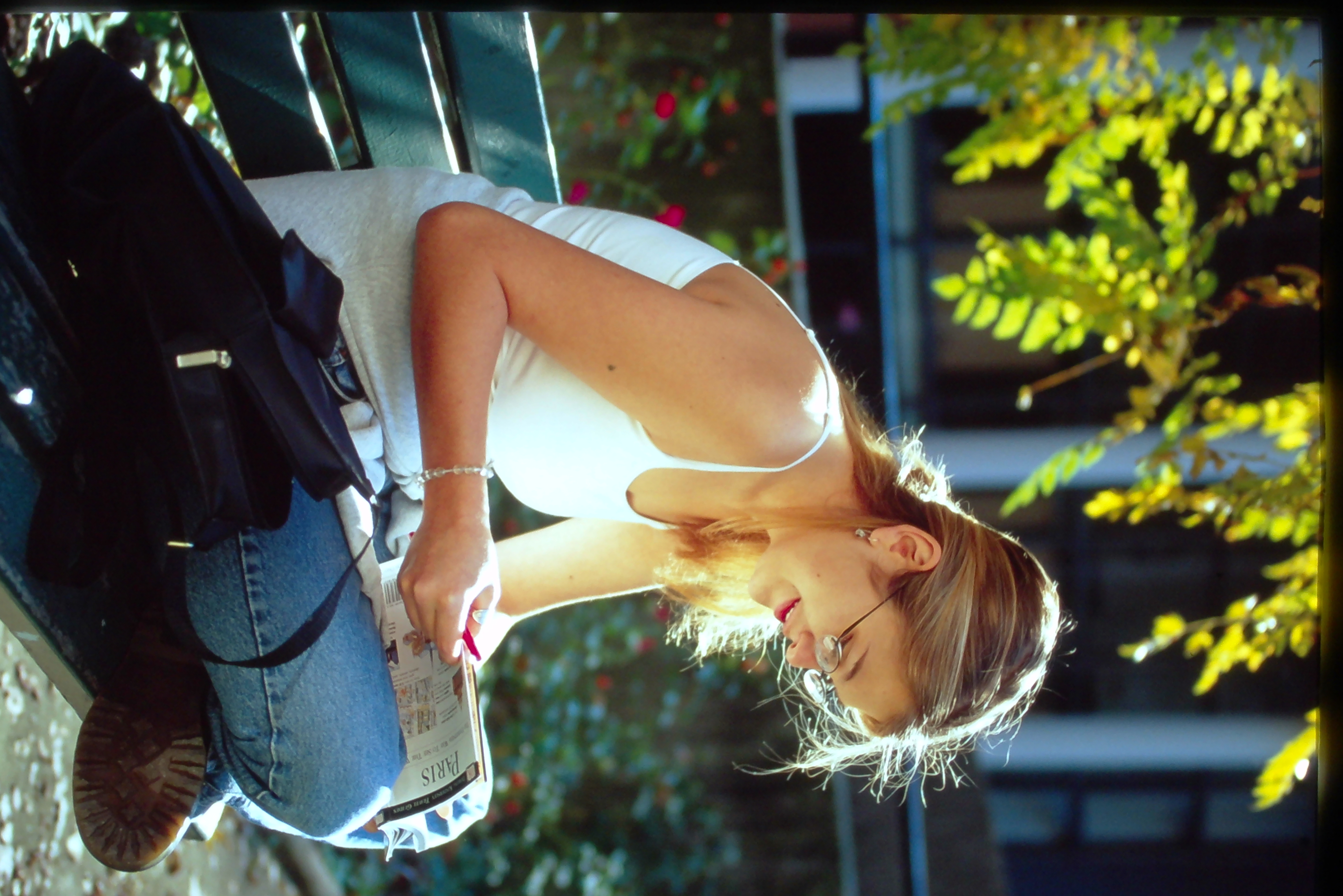 Student reading in Grenelle courtyard